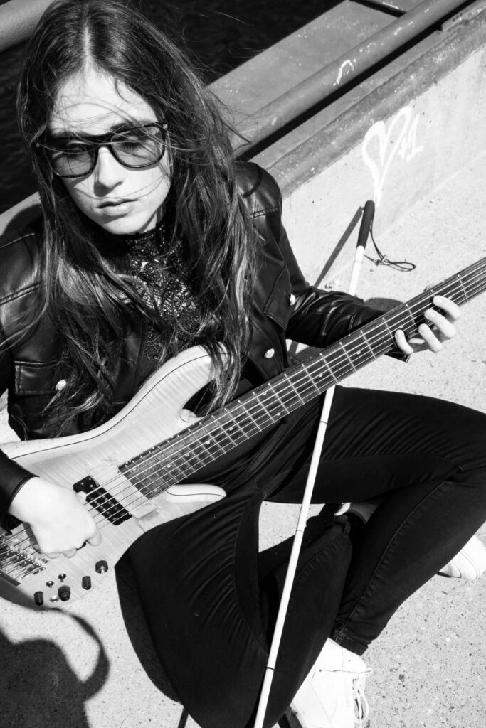 Ciara in black and white with her instrument